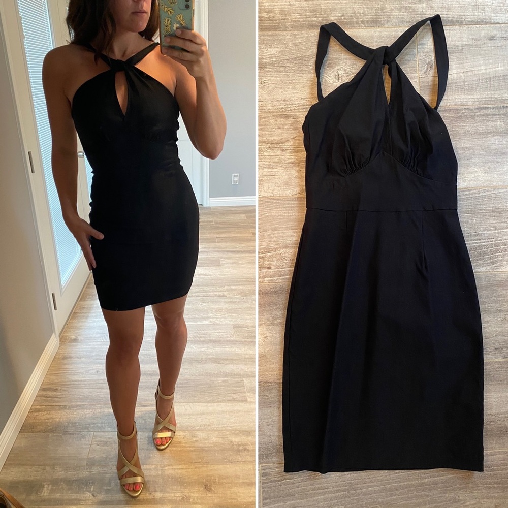 Stop Staring size large black body con dress with peep hole on the chest.